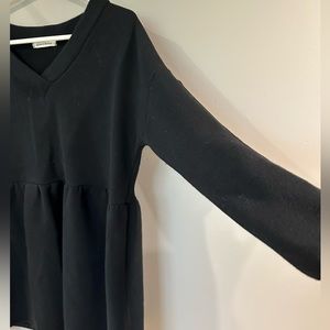 Sweat shirt material with cute flattering detail below the bust